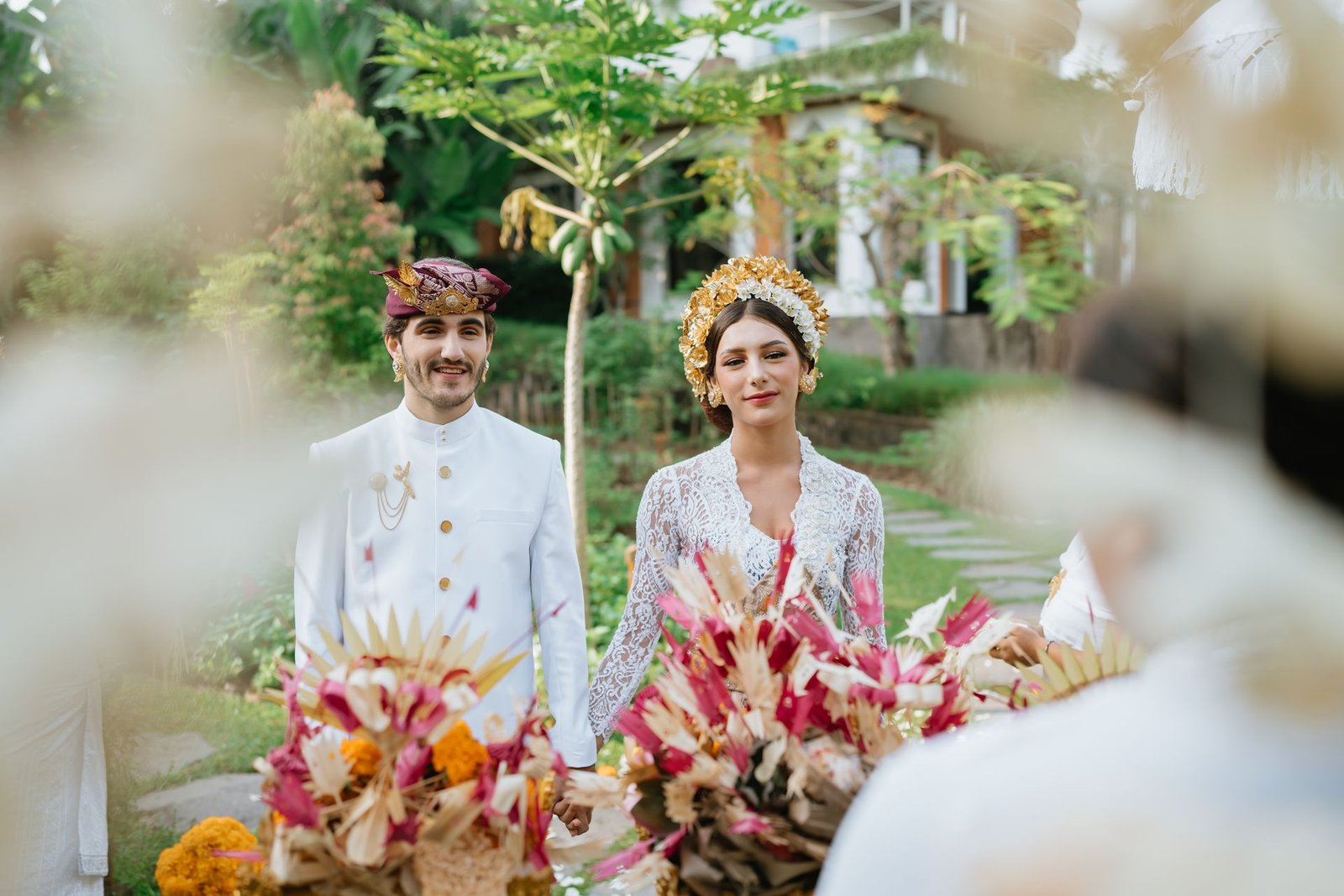 Couple with Balinese ceremonial offerings