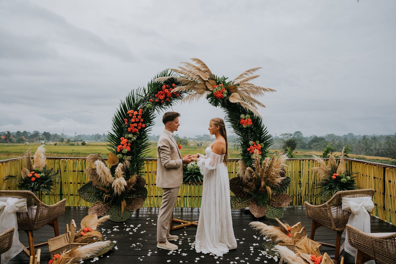 Tropical wedding ceremony with pampas arch in Bali